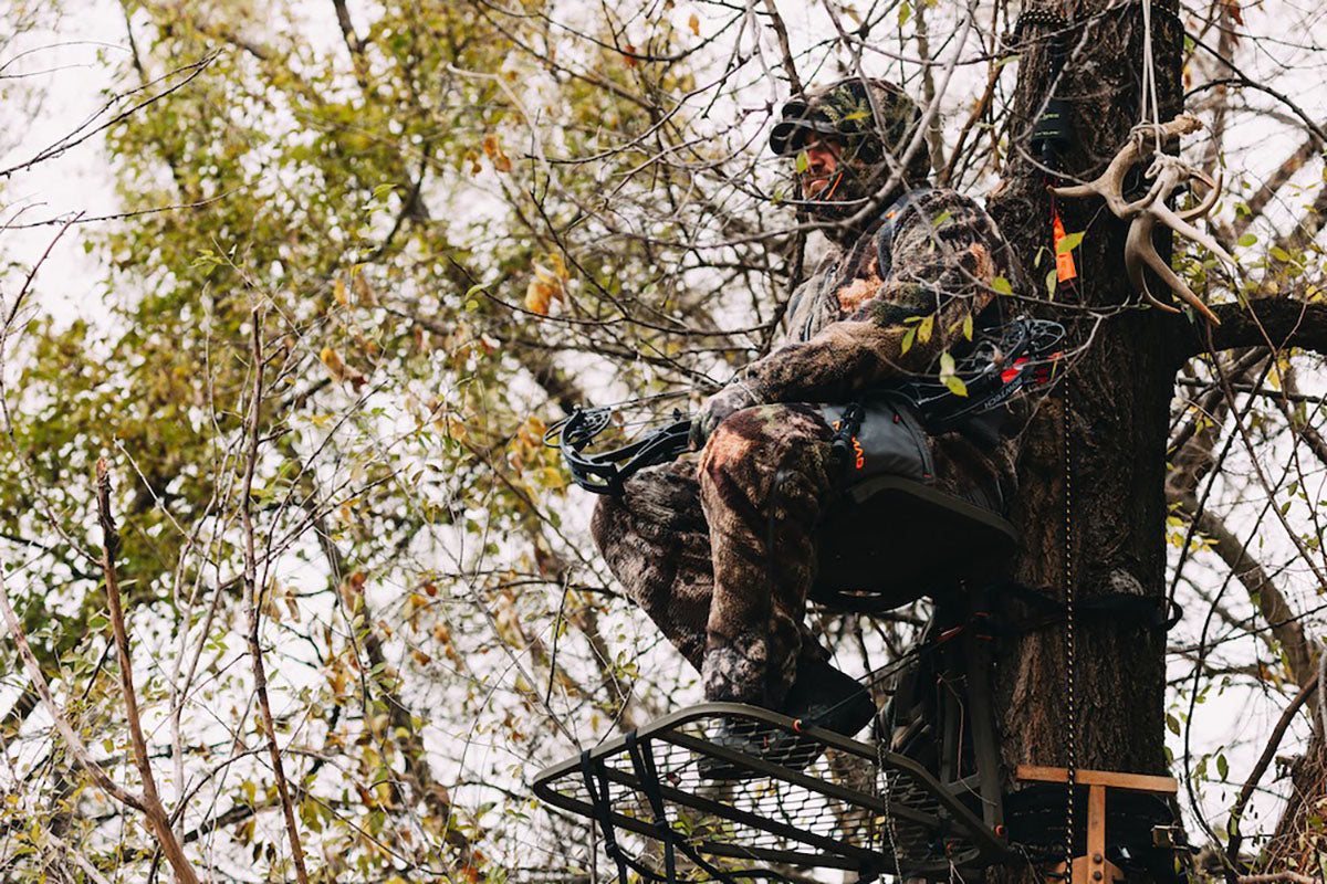 bow hunter in tree stand