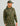 Person wearing camo hoodie with leaf pattern, modeling outdoor apparel in studio setting.